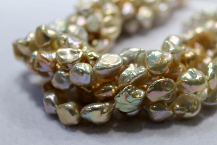 clumped strands of golden keshi pearls