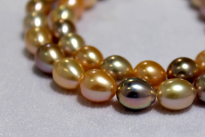 two strands of colorful drop pearls