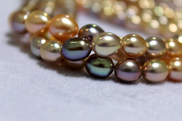 dark and light colored drop pearls