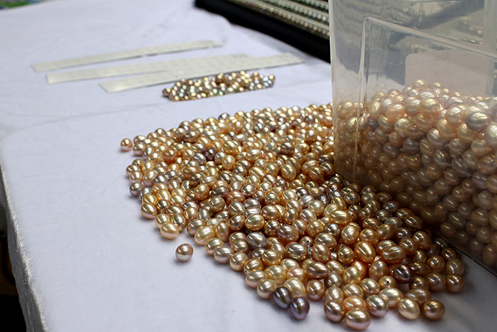 a pile of rare colored drop pearls