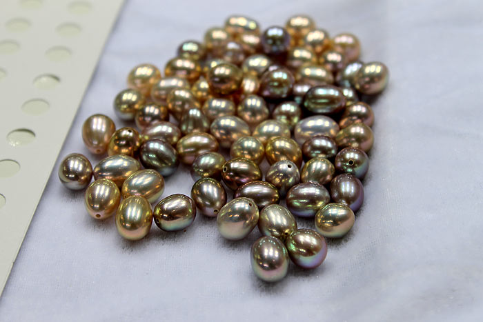 close up of the metallic drop pearls