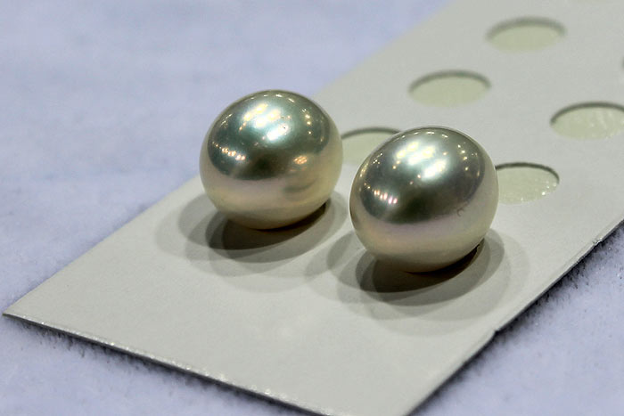 a pair of white drop pearls