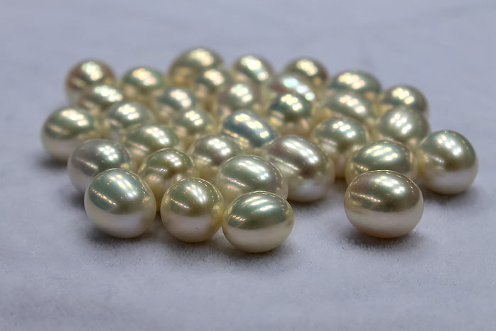 a handful of drop pearls in white colors