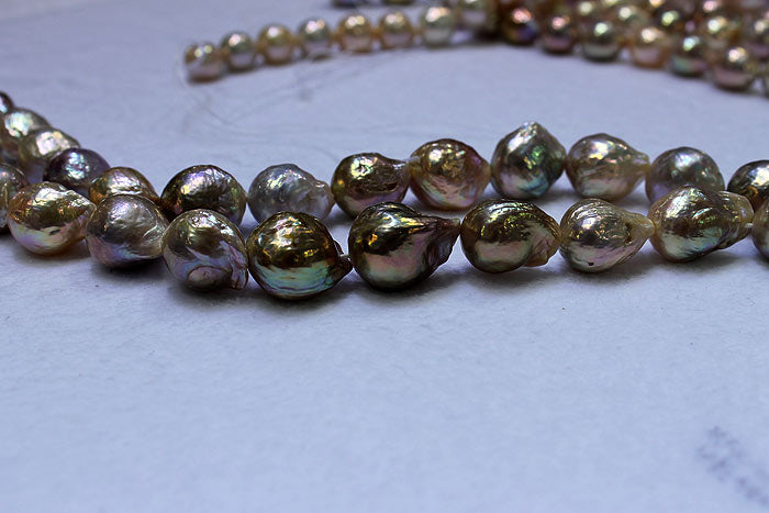 a strand of dark colored ripple pearls
