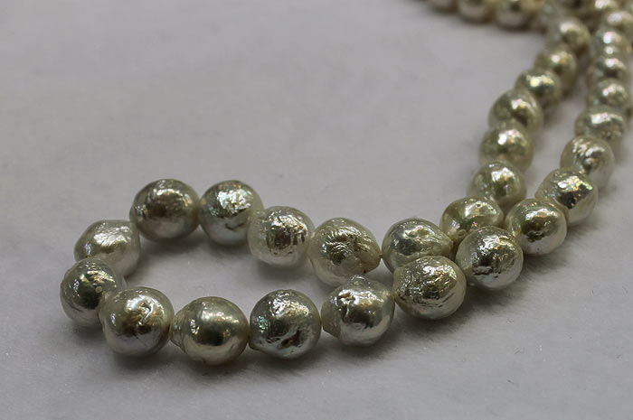 close up of a strand of baby ripple pearls
