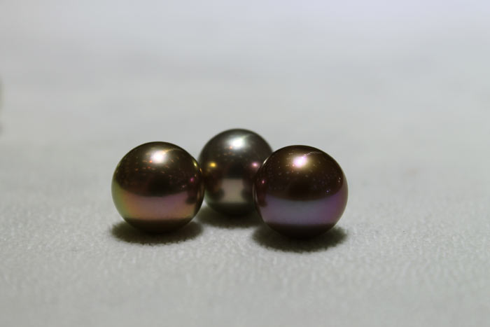 three dark Edison pearls