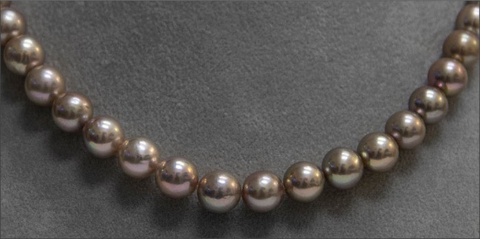 a strand of metallic pearls