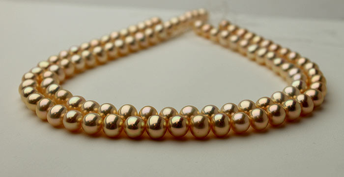 metallic pearls with golden-peach colors