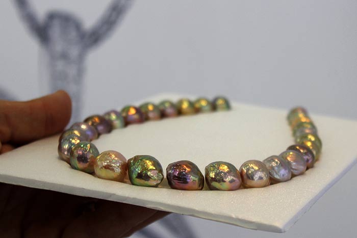 a perfect strand of colorful ripple pearls