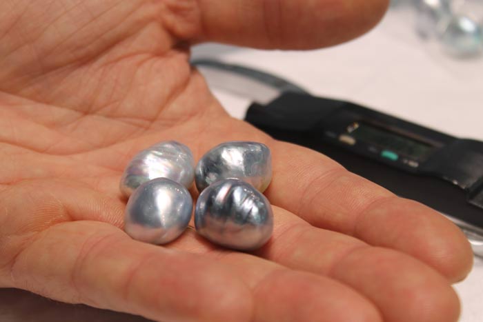 four silver/blue south sea pearls