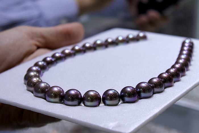 a strand of flawless deep purple Edison pearls