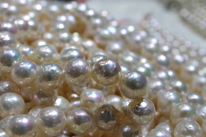 close up of white ripple pearl strands