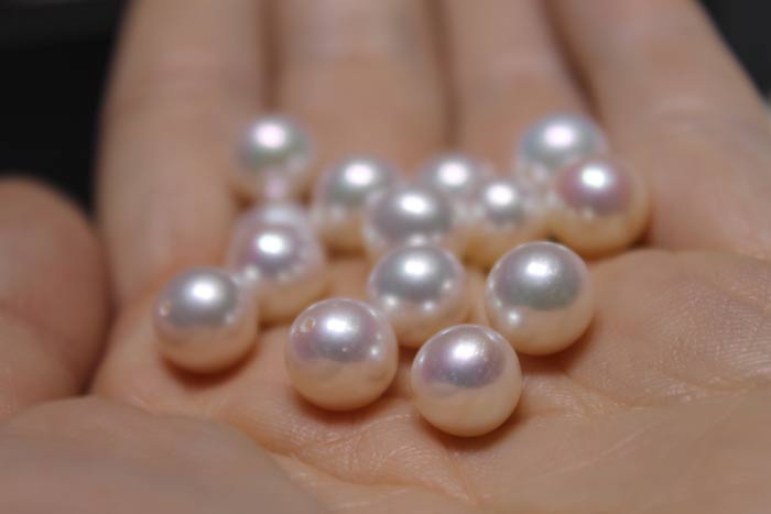 handful of white metallic pearls