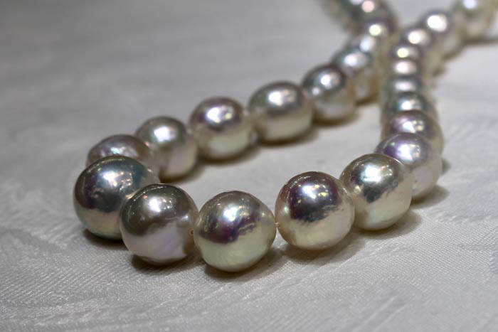 a rope of ripple pearls with metallic luster