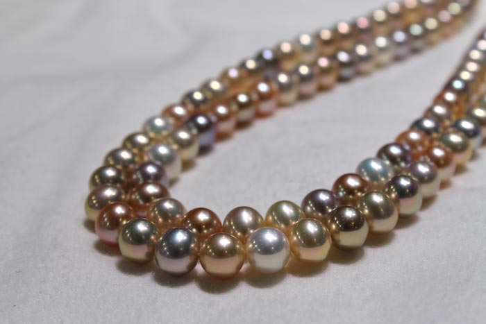 multi-colored strands of metallic pearls