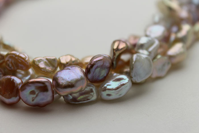 lavender, peach, and silver Keshi on close up