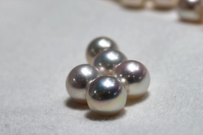 close up of the white metallic pearls