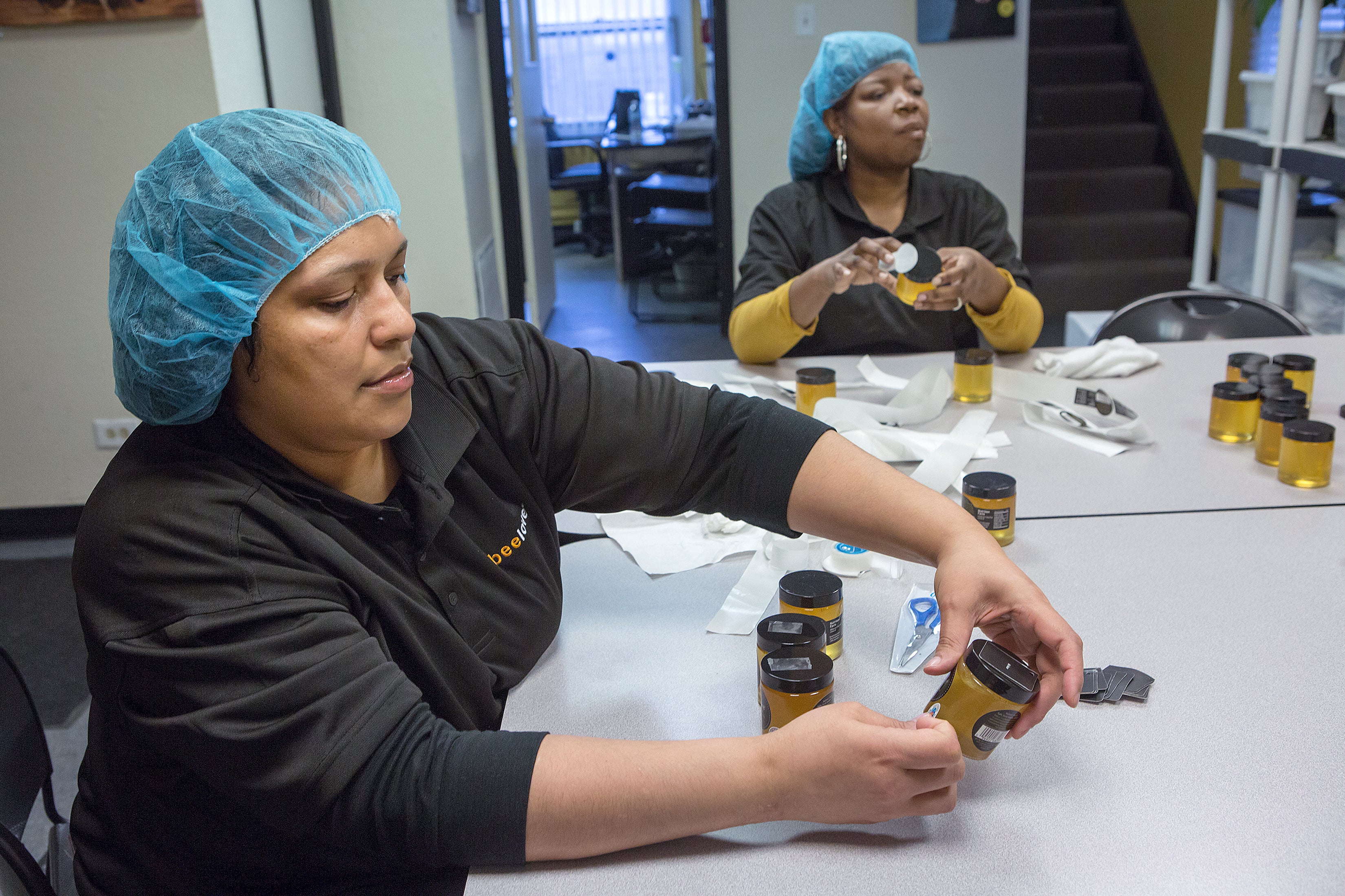 Sweet Beginnings' employees working on the last few steps of production.