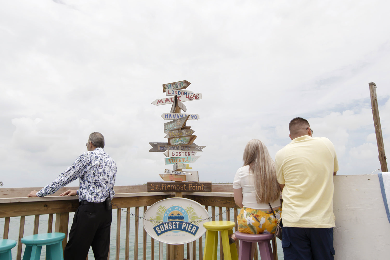 People overlook the water on a pier in Key West, Florida