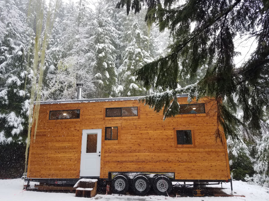 A tiny house set in the forest in winter