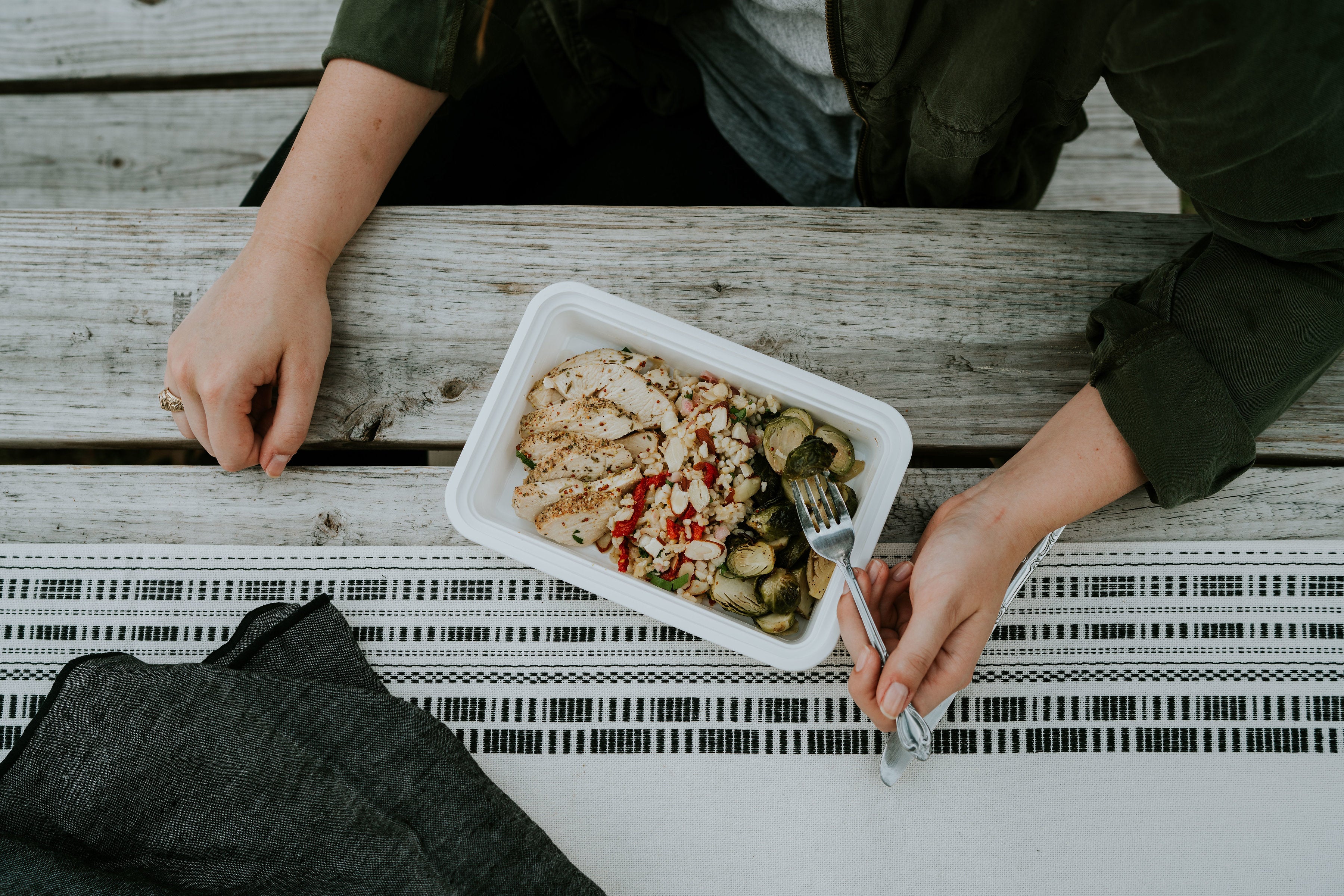 A meal of chicken, brussel sprouts by Eat Well Nashville. 