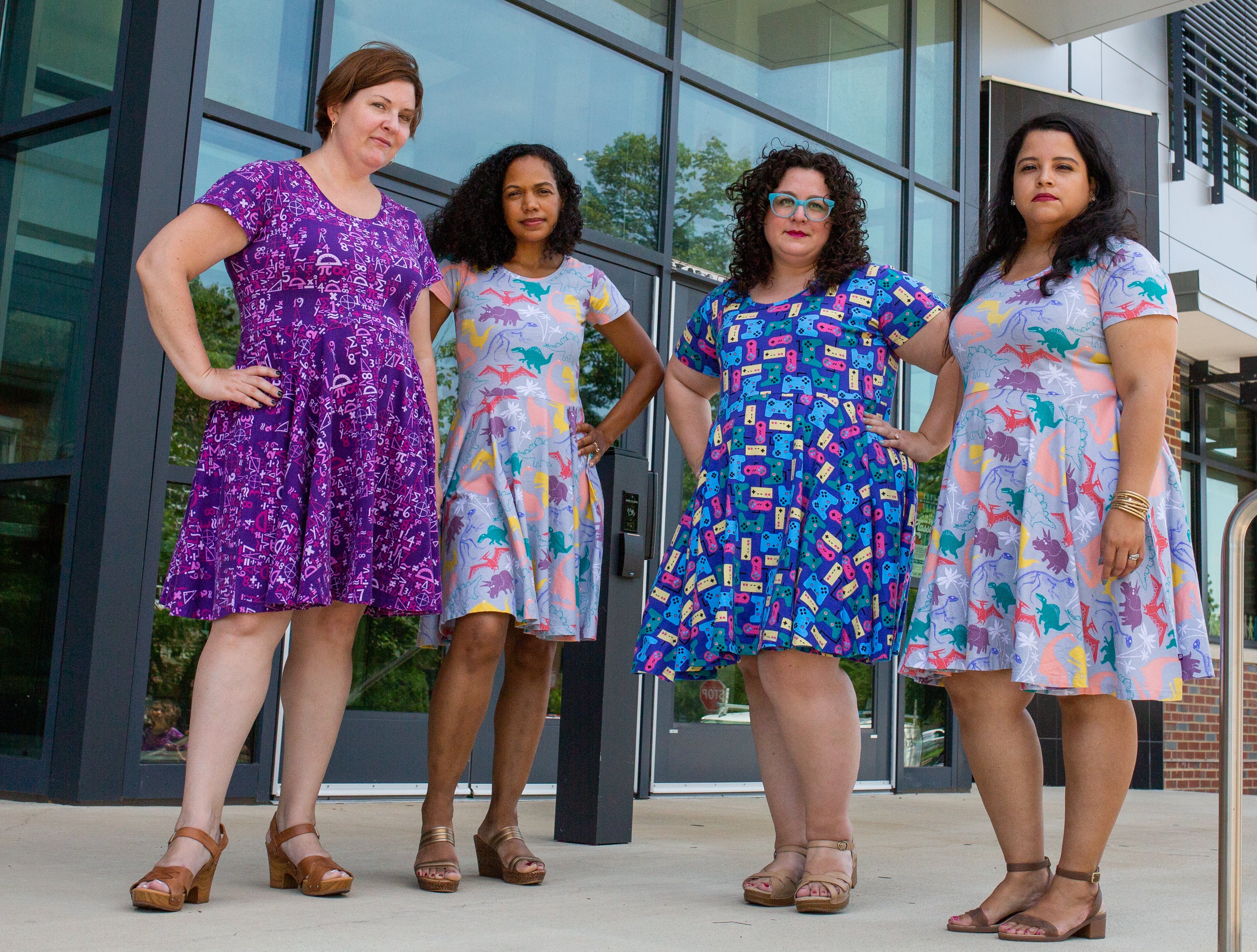 Adults model the new link of dresses from Princess Awesome. 