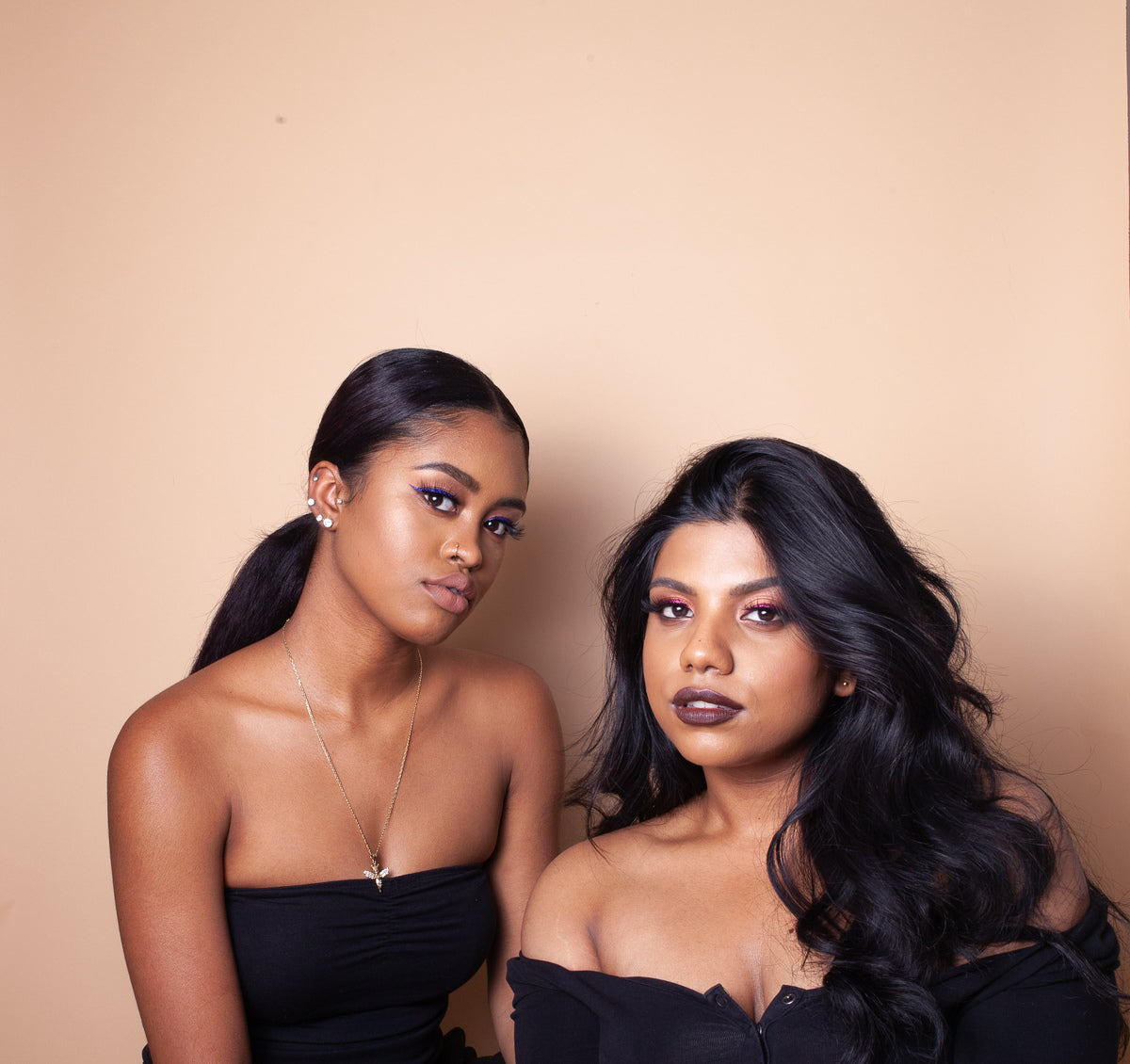 Two models wears products from MFMG Cosmetics. 