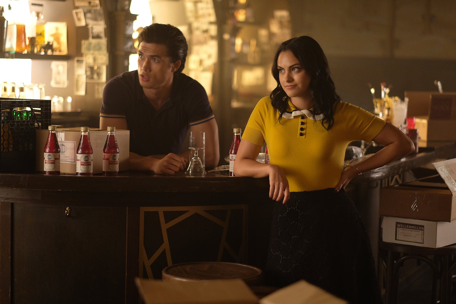 Veronica Lodge and Reggie stand behind the bar in Veronica's speakeasy.