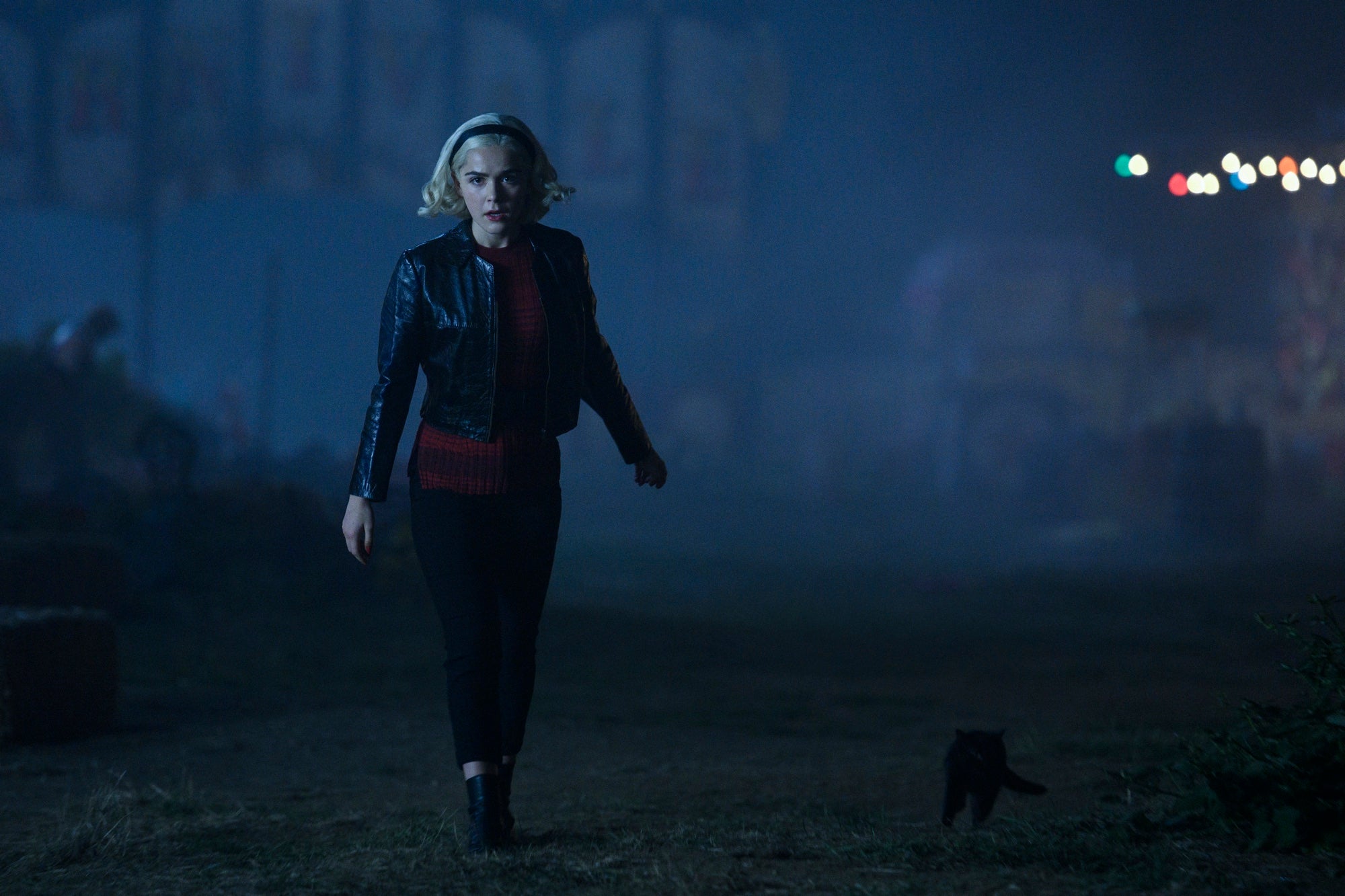 Image of Sabrina Spellman walking toward the camera in an episode of Chilling Adventures of Sabrina