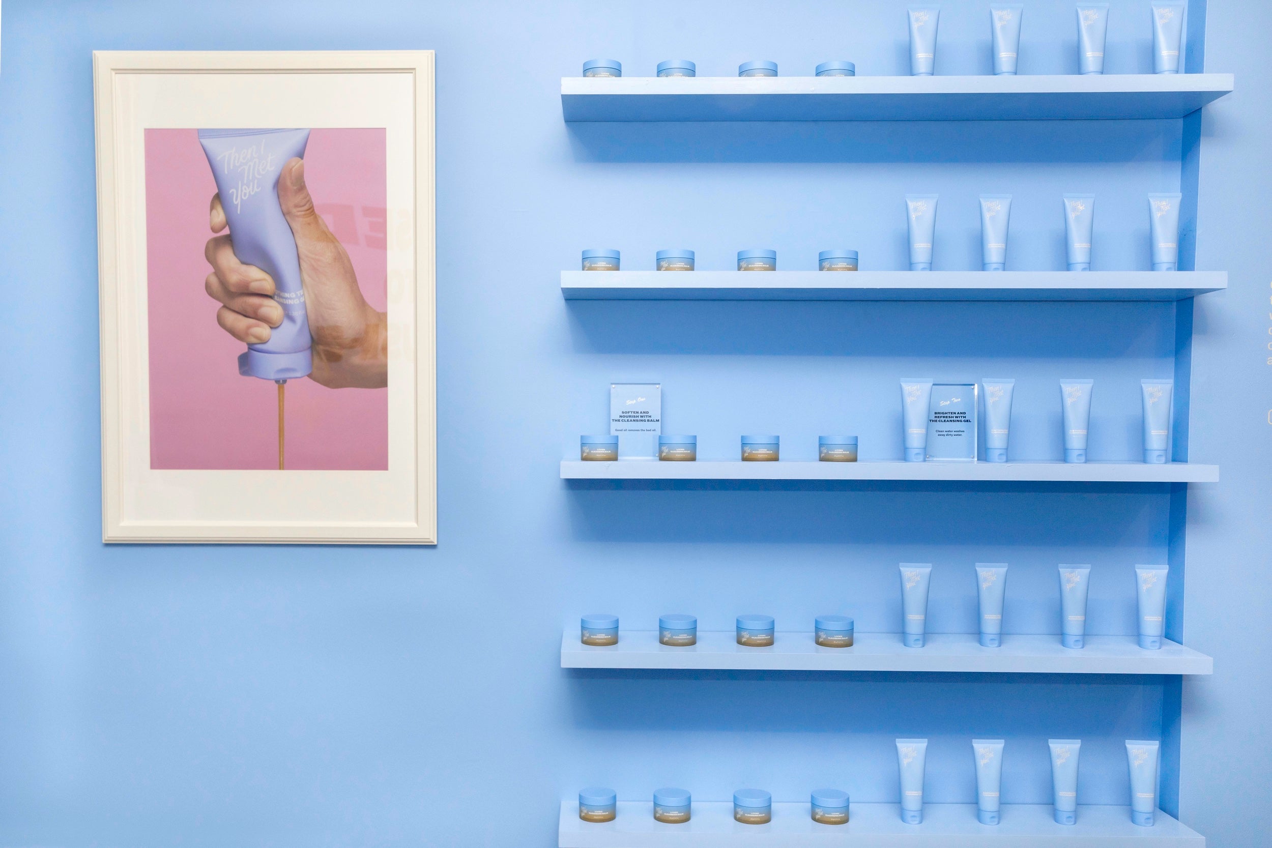 Display of Then I Met You products on a row of shelves against a blue wall