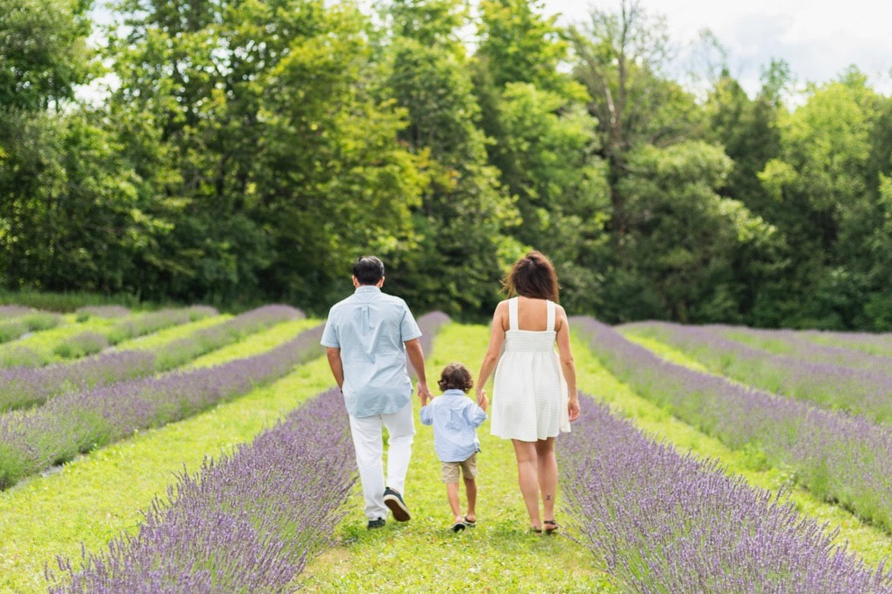 A family walks the grounds of Terre Bleu. 