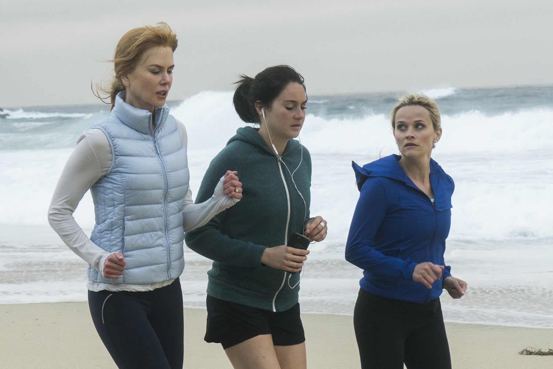 Jane, Madeline, and Celeste run along the beach.