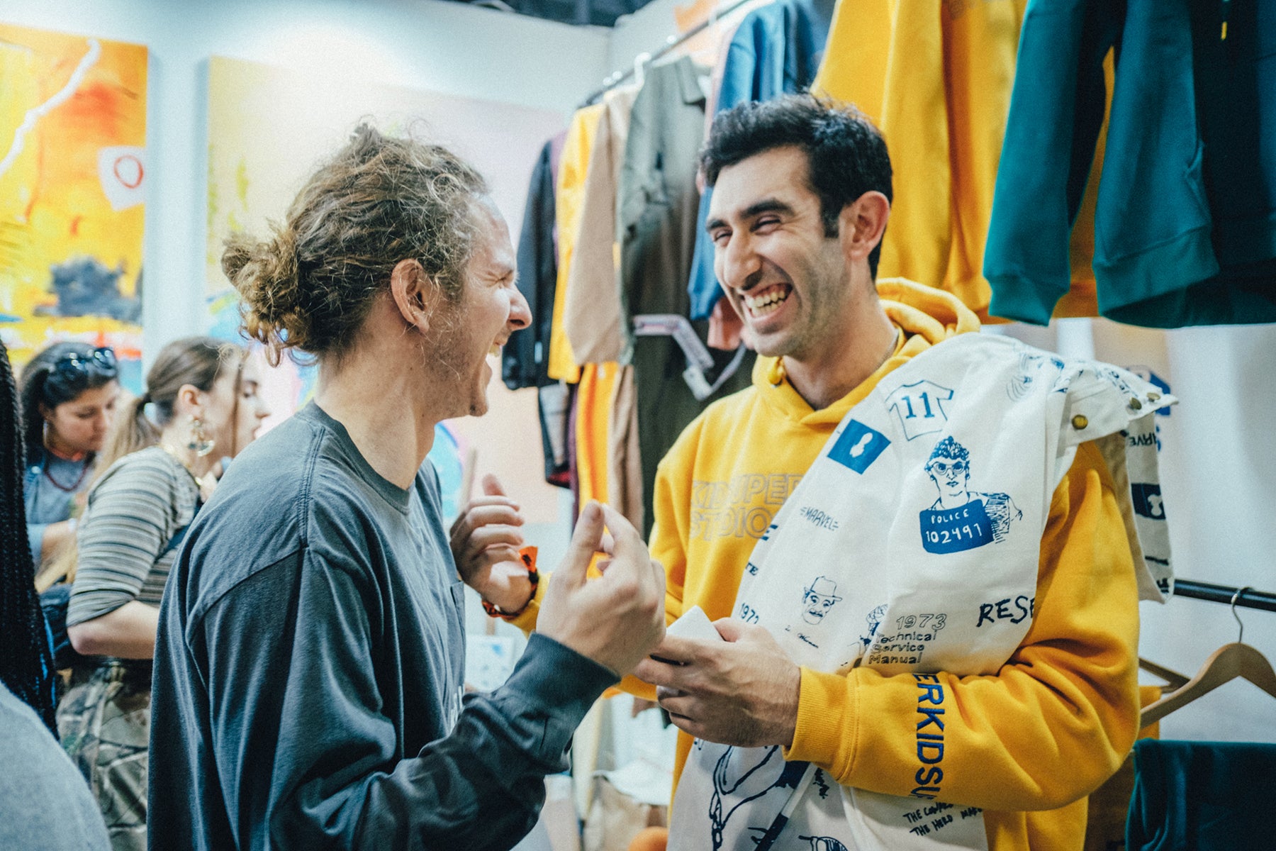 KidSuper designer Colm Dillane greeting a fan in his booth at Complexcon.  