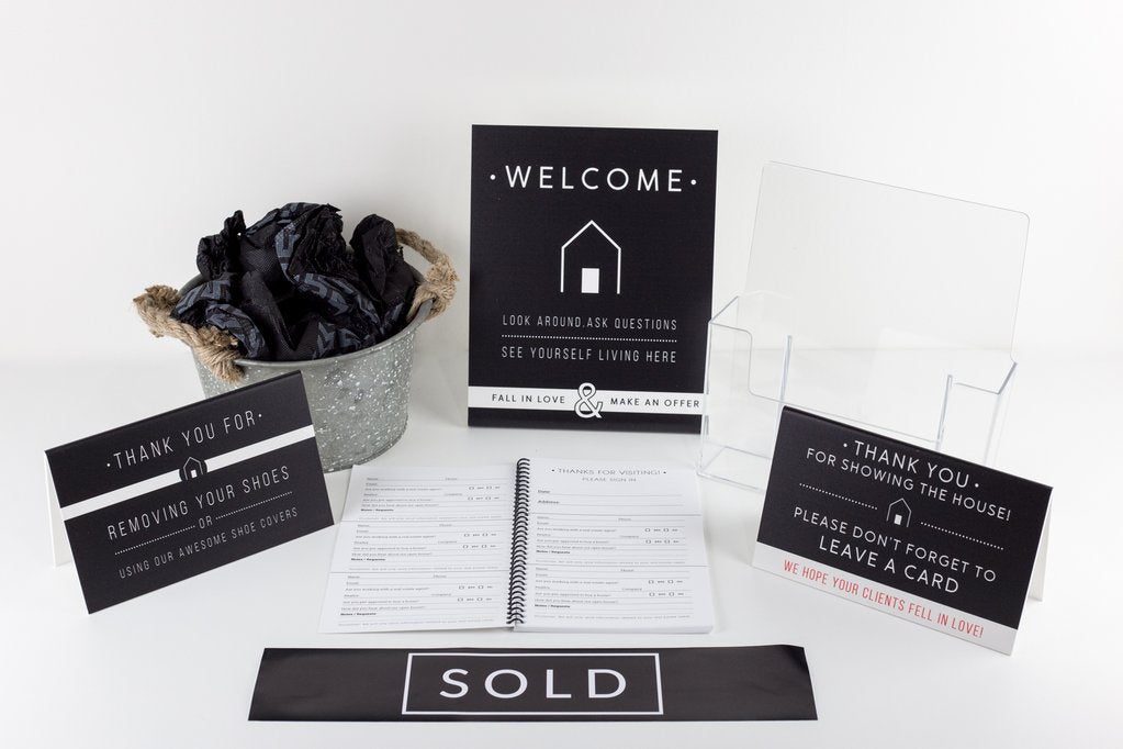 A bundle of signage from All Things Real Estate
