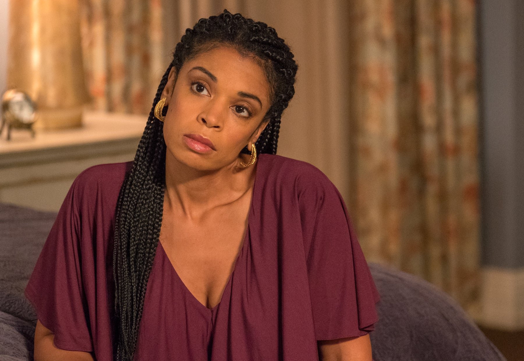 Beth Pearson (Susan Kelechi Watson) looks off camera with a serious expression in an episode of This Is Us.