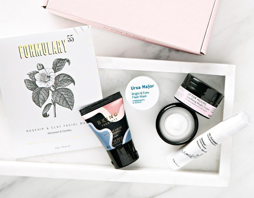 Flat lay of a beauty gift box with multiple skincare products