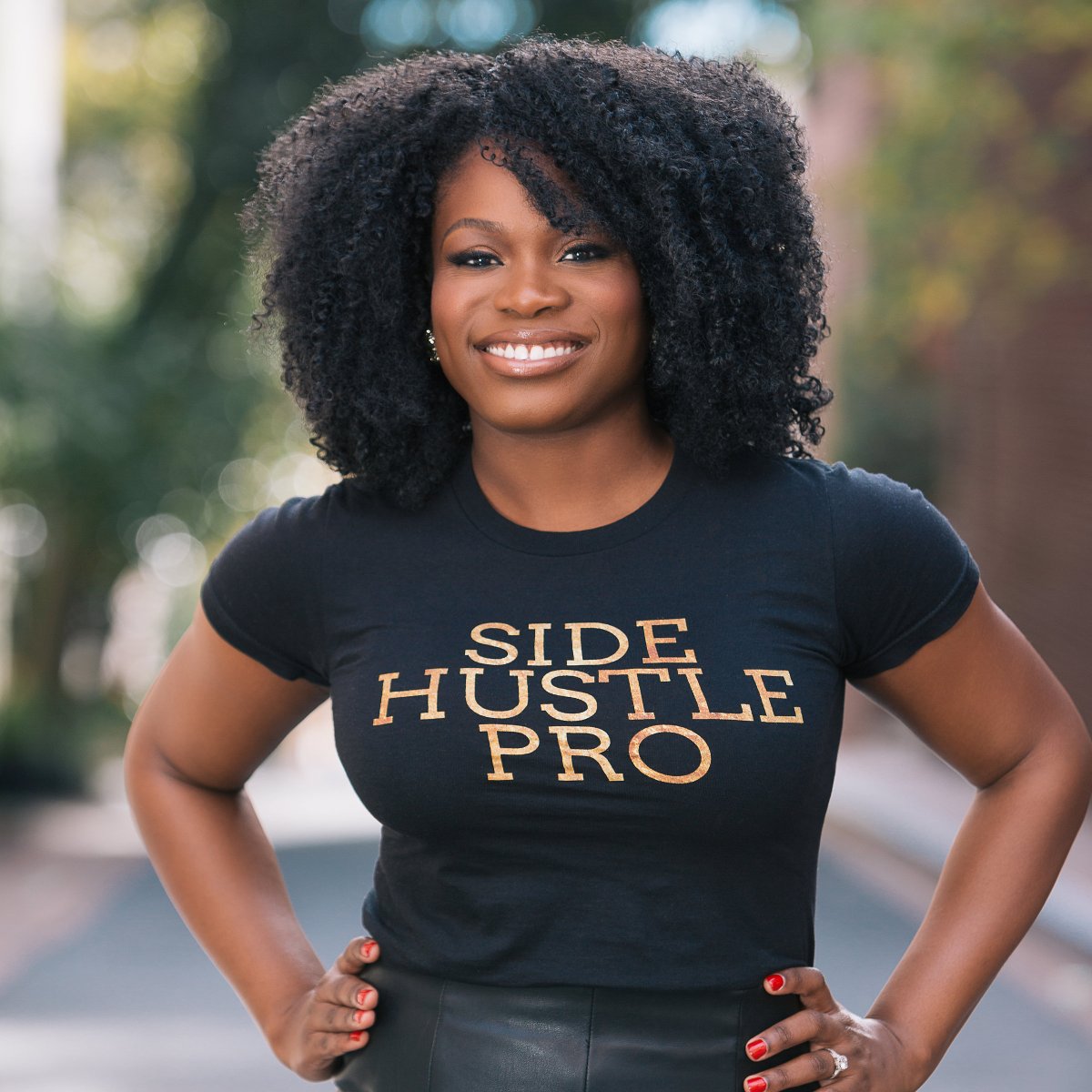 Portrait of Side Hustle Pro podcast host Nicaila Matthews Okome