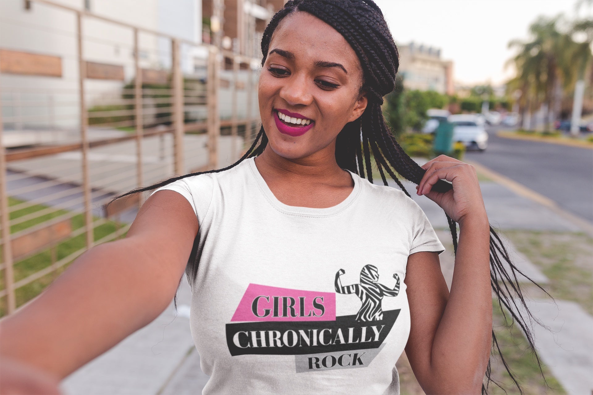 Model wearing a t-shirt that reads "Girls chronically rock"