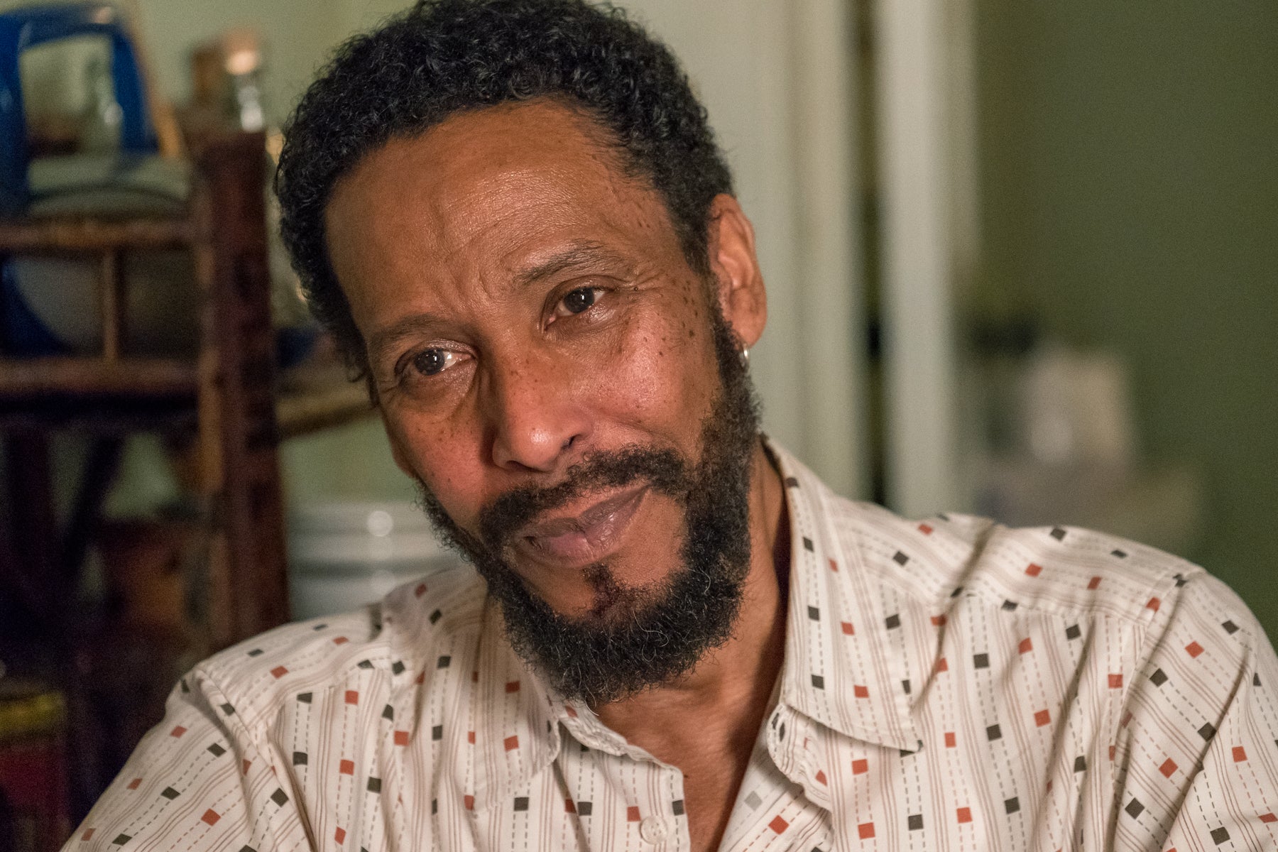 Portrait of William (Ron Cephas Jones) looking off camera in an episode of This Is Us.