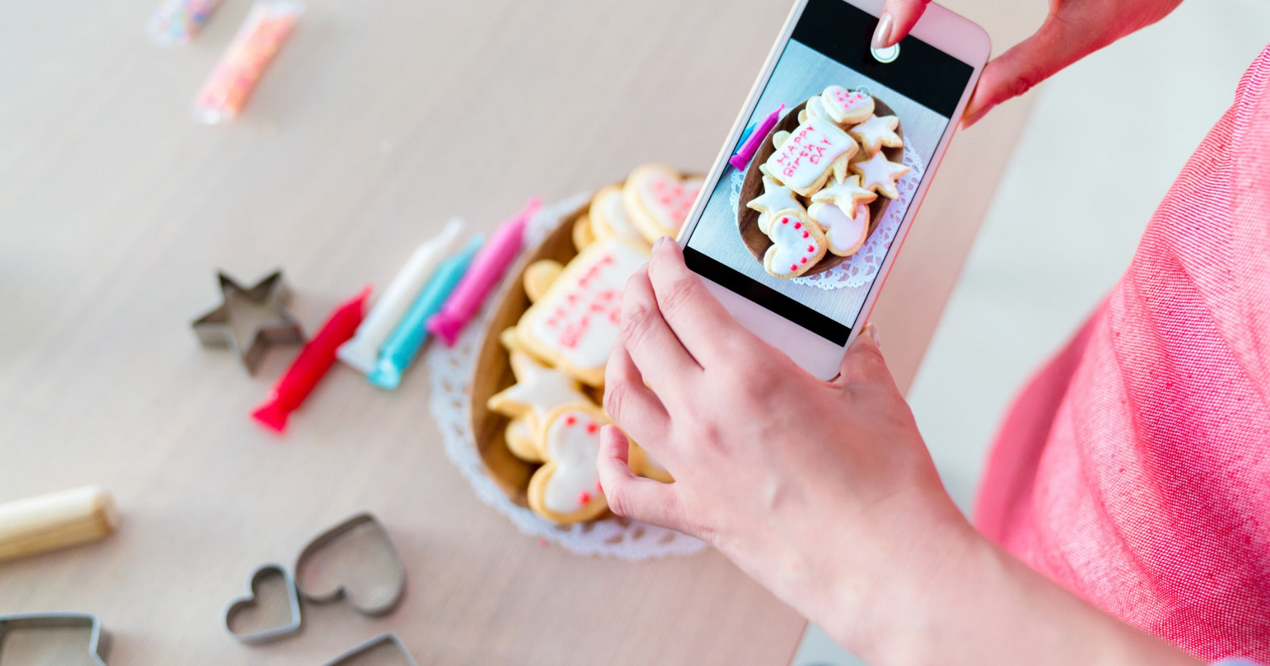 Woman taking product photos on smartphone