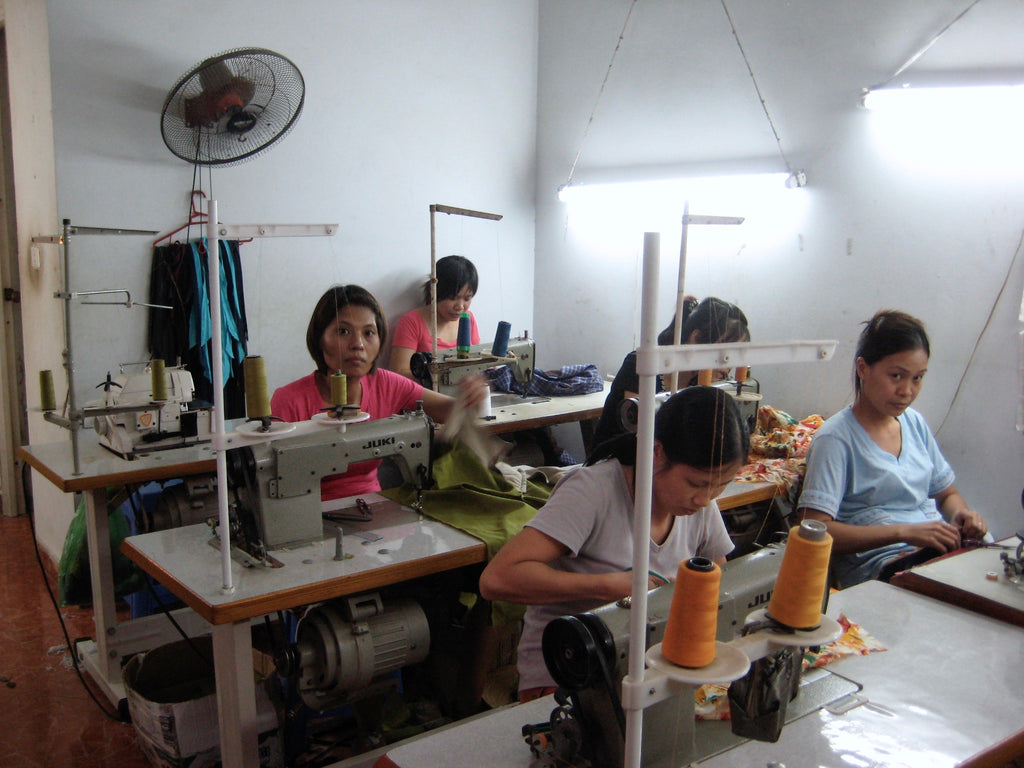 women sewing the collection to be sold in berlin