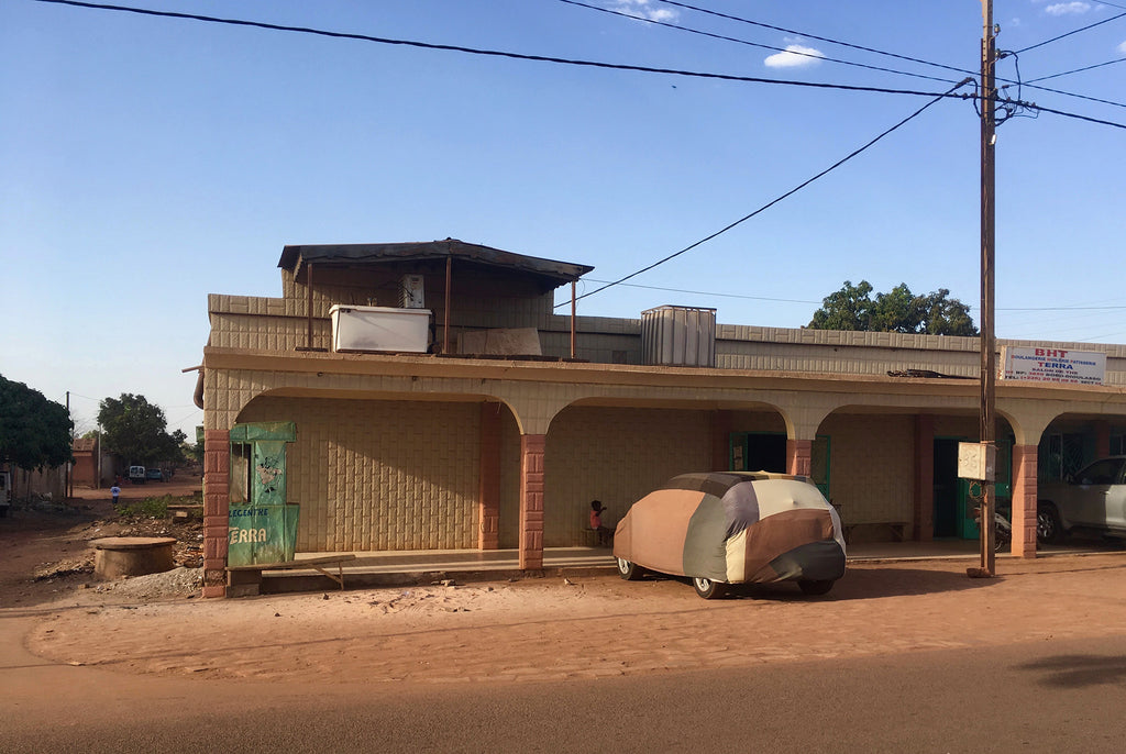 street view, car covered with fabric parked