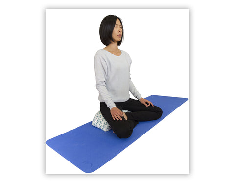 The wave bolster is also perfect for sitting in traditional cross legged meditation