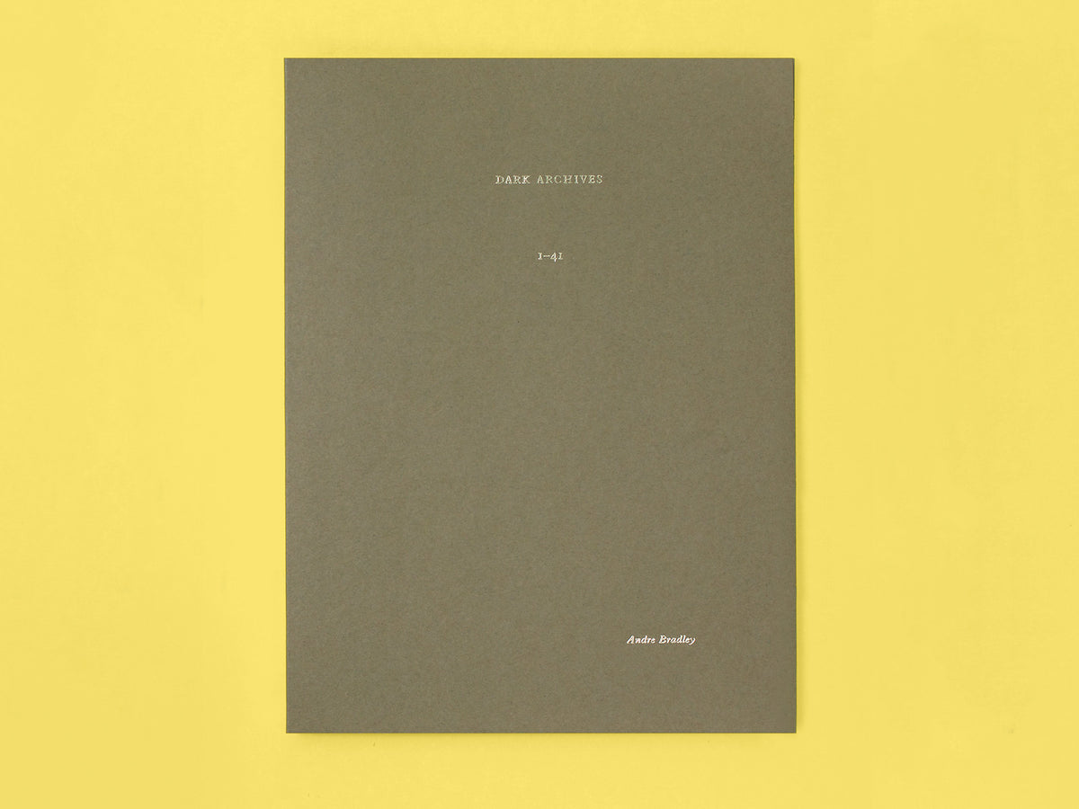 Image of a dark gray folder on a yellow background. The folder has gold letters on it, spelling, "Dark Archives, 1-41" and the author's name, "Andre Bradley."