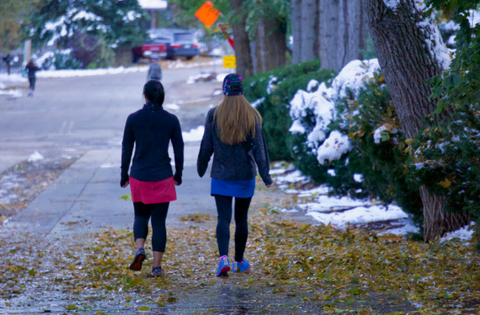 Two women walking on a cold day