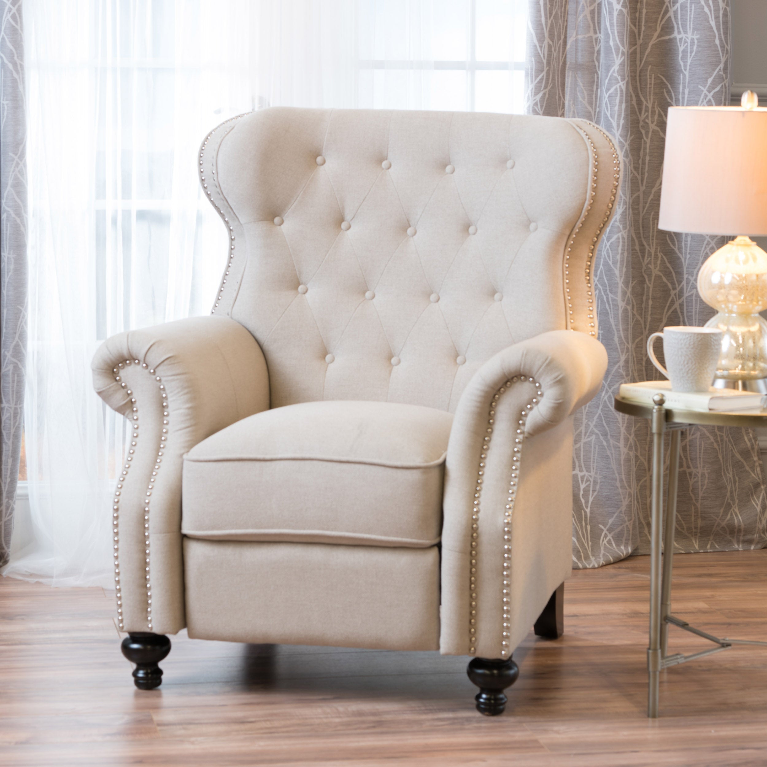 cream tufted recliner