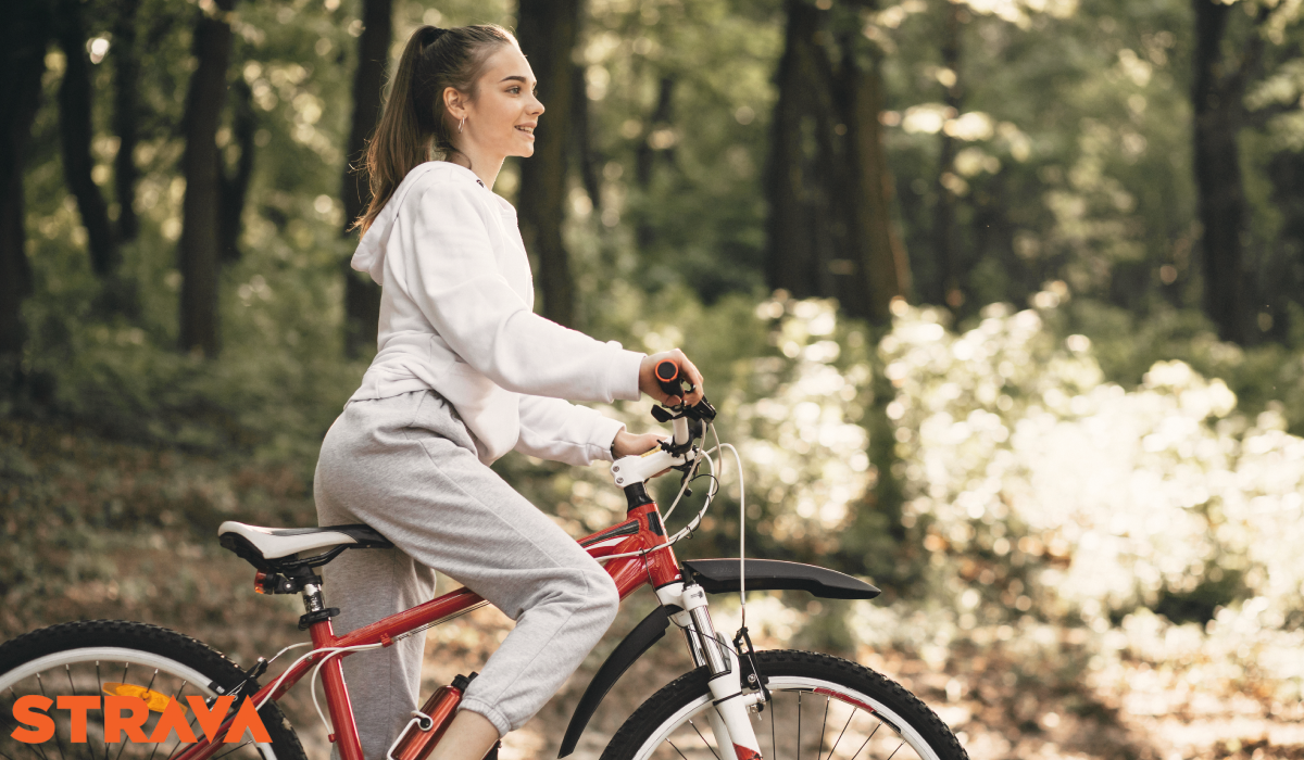 strava app woman riding bicycle