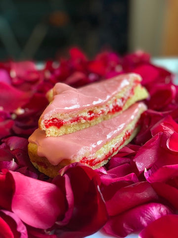 strictly cookies qixi festival secret heart cookie cake soft vanilla cookie cake with pink frosting and red creme inside