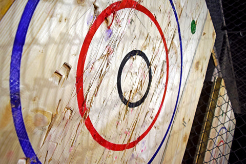 plywood sheet with painted target for ax throwing