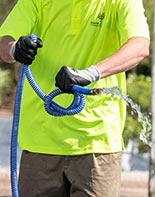 man holding garden hose
